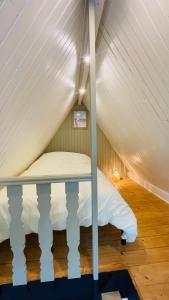 a bedroom with a bed in a attic at Appartement La Cabane de la Baie. in Étaples