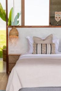 Postel nebo postele na pokoji v ubytování Exotic Seaview villa + 9 fotografií