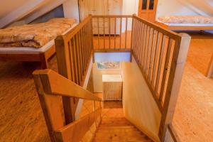 a staircase in a room with two bunk beds at Chalupa Prášily in Prášily