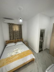 Postel nebo postele na pokoji v ubytování Hotel A & V Dodani + 12 fotografií