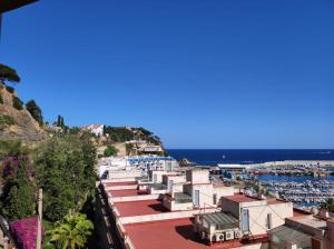 a group of buildings on a hill next to a harbor at Apartamento con vistas in Blanes