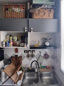 a kitchen with a sink and a counter top at Studio moderne, propre et calme in Melun