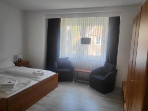 Postel nebo postele na pokoji v ubytování Hotel Brandaris