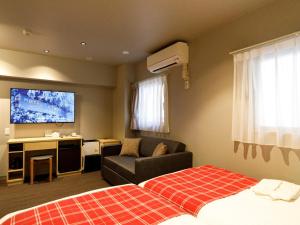 Télévision ou salle de divertissement dans l'établissement Hotel La Foresta By Rigna
