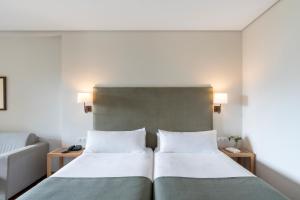 Un ou plusieurs lits dans un hébergement de l'établissement Parador de Ronda