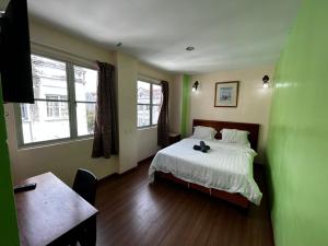 מיטה או מיטות בחדר ב-Hotel Harbour Stay