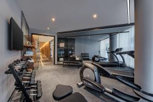 a gym with several cardio machines in a room at Atour X Hotel Xi'an Northwestern Polytechnical University Subway Station in Xi'an