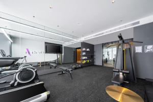 a room with a gym with a flat screen tv at Atour Hotel Nantong Longxin Plaza in Nantong