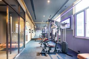 a room with a gym with exercise equipment in it at Atour Hotel Suqian Industrial Park Wuyue Plaza in Suqian