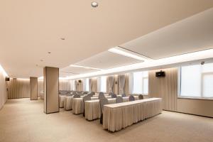 a room with rows of chairs in a building at Atour Hotel Fuzhou Jinshan Aegean Sea in Fuzhou