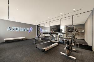 a gym with cardio equipment in a hotel room at Atour X Hotel Wuxi Binhu Sports Center in Wuxi