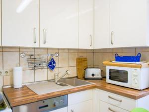 Kuchyň nebo kuchyňský kout v ubytování Haus Schneverdingen + 14 fotografií