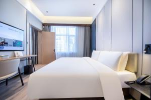 Postel nebo postele na pokoji v ubytování Atour X Hotel Shenyang Beiling Park