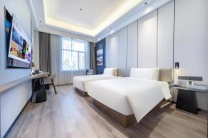 Postel nebo postele na pokoji v ubytování Atour X Hotel Shenyang Beiling Park