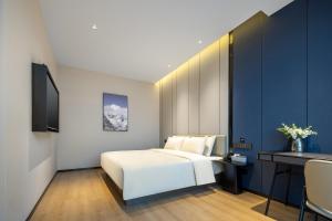 Katil atau katil-katil dalam bilik di Atour X Hotel Changzhou Jintan District Government