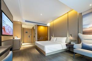 Atour Hotel Kunshan Chengdong Development Zoneにあるベッド