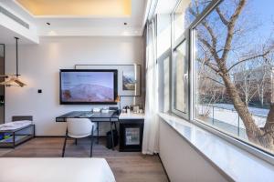 TV a/nebo společenská místnost v ubytování Atour X Hotel Shenyang Beiling Park