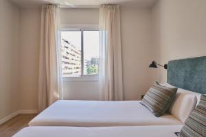Posteľ alebo postele v izbe v ubytovaní Arenas Atiram Hotel