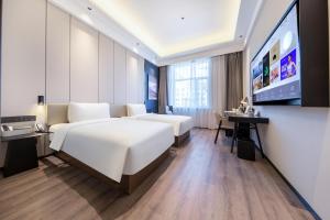 Postel nebo postele na pokoji v ubytování Atour X Hotel Shenyang Beiling Park