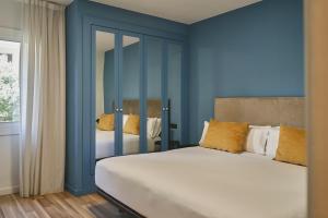 Posteľ alebo postele v izbe v ubytovaní Arenas Atiram Hotel