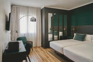 Posteľ alebo postele v izbe v ubytovaní Arenas Atiram Hotel