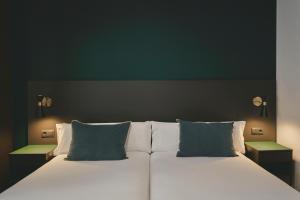 Posteľ alebo postele v izbe v ubytovaní Arenas Atiram Hotel