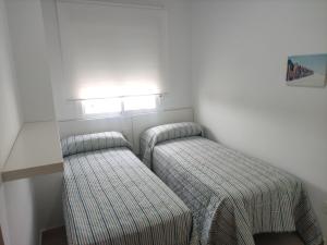 Posteľ alebo postele v izbe v ubytovaní Apartamentos Montedunas