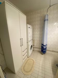 a laundry room with a washer and dryer at Apartment in Kotka in Kotka