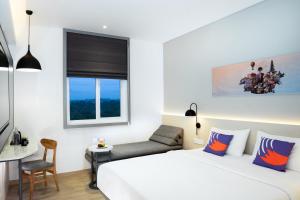 Postel nebo postele na pokoji v ubytování FOX Lite Hotel Samarinda