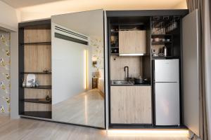 a kitchen with a large sliding glass door at #FLH -The Koi Apartment, Thessaloniki in Thessaloniki