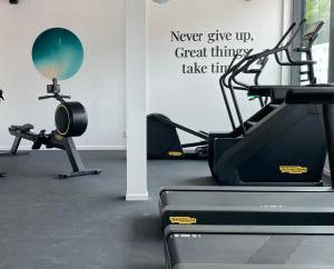 a gym with a treadmill and two exercise bikes at UNITY Malmö in Malmö