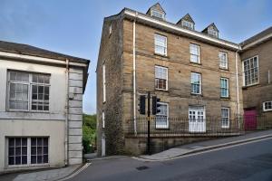 an old brick building on the side of a street at Finest Retreats - Valley View in Camelford