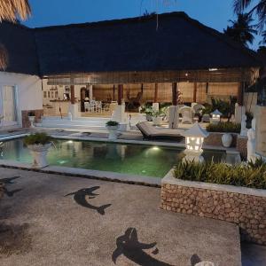 a swimming pool in a villa with a resort at Puri Mas Boutique Resort & Spa in Senggigi 