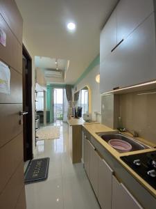 a kitchen with a sink and a counter top at VidaView Apart for Family Syariah by NAD in Pampang