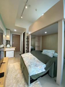En eller flere senge i et værelse på VidaView Apart for Family Syariah by NAD