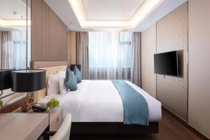 Sjónvarps- og/eða afþreyingartæki á Rocase Boutique Hotel Wuxi