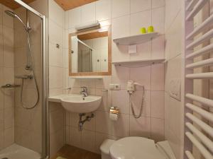 a bathroom with a sink and a toilet and a shower at Haus Lentsch in Kaunerberg