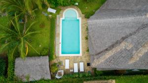 an overhead view of a house with a swimming pool at Nyumba ya Afrika in Watamu