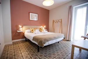 Ένα ή περισσότερα κρεβάτια σε δωμάτιο στο Apartamentos Doña Concha