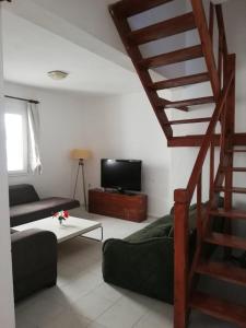 a living room with a staircase and a couch at House with garden in Bodrum in Bodrum City