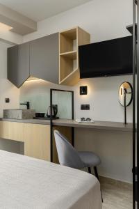 Kuchyň nebo kuchyňský kout v ubytování Costa De Luxe Suites