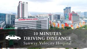 a city skyline with a white car on top of buildings at Smile Hotel Cheras Sri Permaisuri in Kuala Lumpur