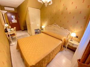 Кровать или кровати в номере Hotel San Gallo