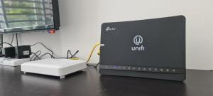 a laptop computer sitting on top of a desk at The Simplicity Homestay in Tanah Rata