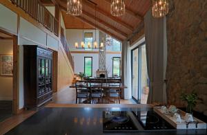 a kitchen and dining room with a table and chairs at LAAN Retreat-DaLat in Da Lat