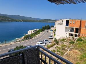 a view from a balcony of a road and water at Apartments Menalo in Neum