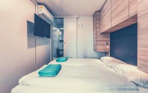 מיטה או מיטות בחדר ב-Bungalows Tenuta Primero