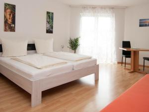 Letto o letti in una camera di Hotel Scheffelhof
