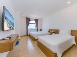 Postel nebo postele na pokoji v ubytování An Bình Tân Hotel