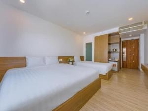 Postel nebo postele na pokoji v ubytování An Bình Tân Hotel